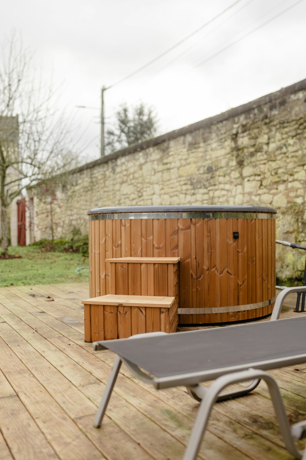 Outdoor hot tub on a wooden deck at sunset — spa living in Flagstaff